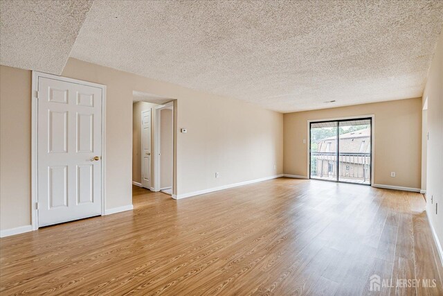 223 Edison Glen Ter, Edison, NJ 08837 - spare room with a textured ceiling and light wood-style floors