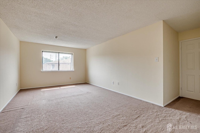 223 Edison Glen Ter, Edison, NJ 08837 - spare room with carpet and a textured ceiling