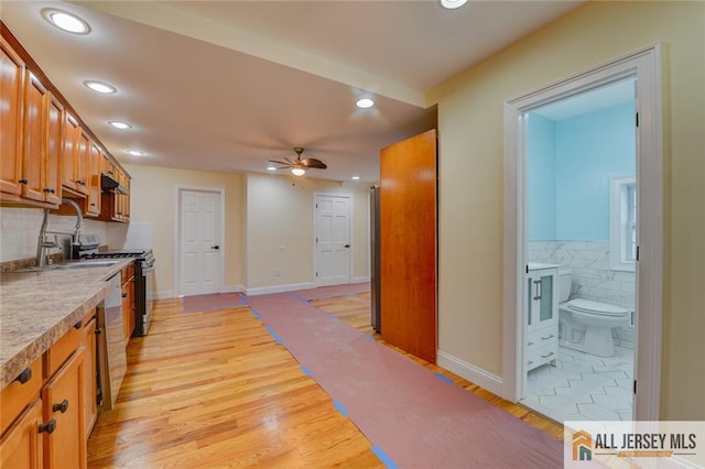 607 Almon Ave, Woodbridge Proper, NJ 07095 - kitchen featuring stainless steel appliances, light countertops, recessed lighting, brown cabinets, and a ceiling fan