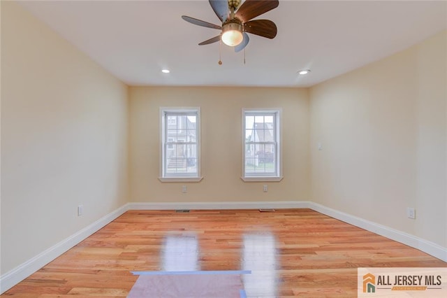 unfurnished room featuring a ceiling fan, baseboards, light wood-style floors, and recessed lighting