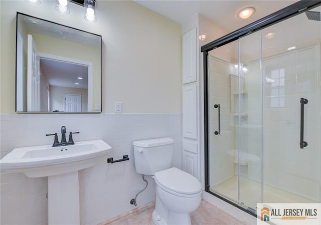 607 Almon Ave, Woodbridge Proper, NJ 07095 - full bath with a shower stall, tile walls, a wainscoted wall, and tile patterned flooring