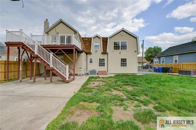 607 Almon Ave, Woodbridge Proper, NJ 07095 - back of house with a gambrel roof, a deck, and stairs