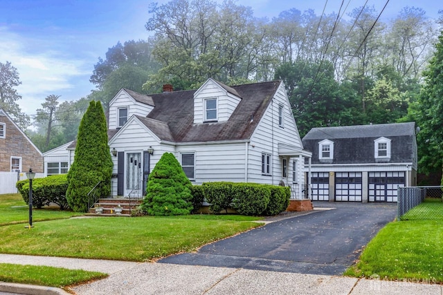 125 Deerfield Rd, Sayreville, NJ 08872 - view of front of house featuring an outdoor structure, a garage, asphalt driveway, and a shingled roof