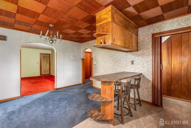 125 Deerfield Rd, Sayreville, NJ 08872 - kitchen with arched walkways, wooden ceiling, open shelves, baseboards, and wallpapered walls
