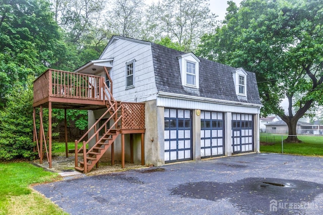 125 Deerfield Rd, Sayreville, NJ 08872 - view of front of property featuring roof with shingles, a gambrel roof, a deck, stairs, and a detached garage