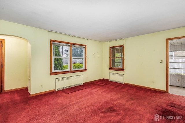 125 Deerfield Rd, Sayreville, NJ 08872 - spare room featuring radiator, healthy amount of natural light, and carpet