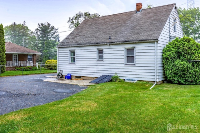 125 Deerfield Rd, Sayreville, NJ 08872 - rear view of property featuring a chimney and roof with shingles