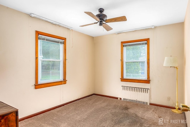 125 Deerfield Rd, Sayreville, NJ 08872 - unfurnished room featuring radiator, carpet floors, ceiling fan, and baseboards