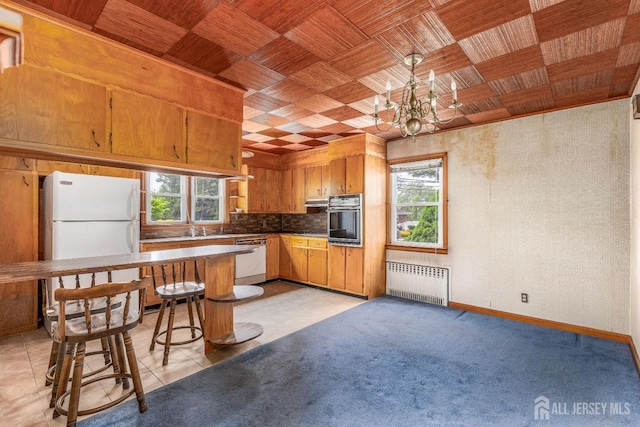 125 Deerfield Rd, Sayreville, NJ 08872 - kitchen with radiator, white appliances, a chandelier, tasteful backsplash, and wooden ceiling