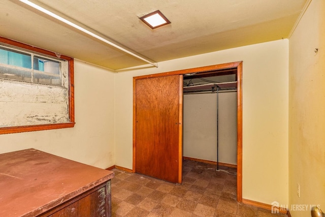125 Deerfield Rd, Sayreville, NJ 08872 - unfurnished bedroom featuring dark floors, a closet, and baseboards