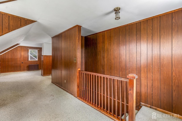 125 Deerfield Rd, Sayreville, NJ 08872 - bonus room featuring wooden walls, carpet, vaulted ceiling, and radiator heating unit