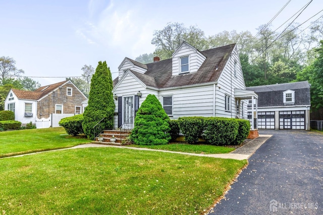 125 Deerfield Rd, Sayreville, NJ 08872 - cape cod house featuring driveway, an outbuilding, a front yard, and a chimney