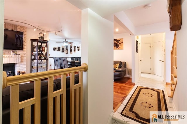 96 Riverbend Dr, North Brunswick, NJ 08902 - hallway featuring rail lighting and light tile patterned floors