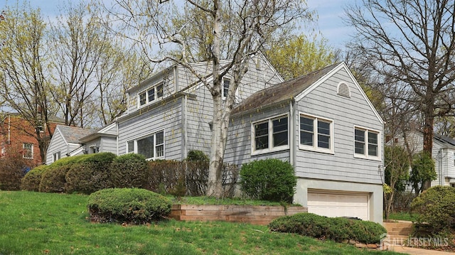 707 S 1st Ave, Highland Park, NJ 08904 - view of home's exterior featuring a lawn and an attached garage