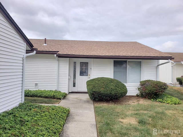 17 Celtis Plz Unit B, Monroe, NJ 08831 - property entrance featuring a shingled roof and a yard