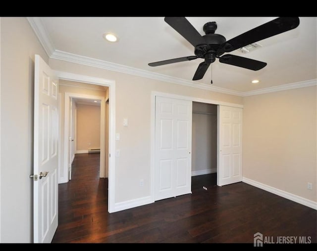 17 Celtis Plz Unit B, Monroe, NJ 08831 - unfurnished bedroom with crown molding, dark wood-style floors, recessed lighting, a baseboard radiator, and a closet
