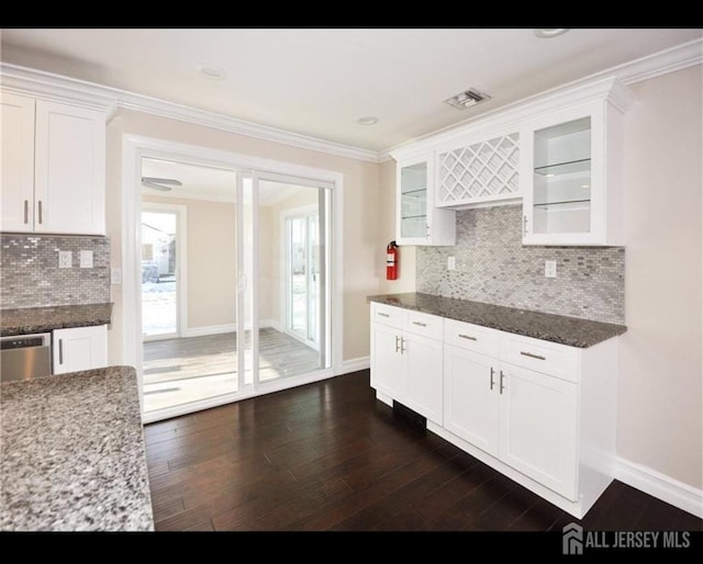 17 Celtis Plz Unit B, Monroe, NJ 08831 - kitchen with dark wood-style floors, white cabinetry, glass insert cabinets, backsplash, and dark stone counters