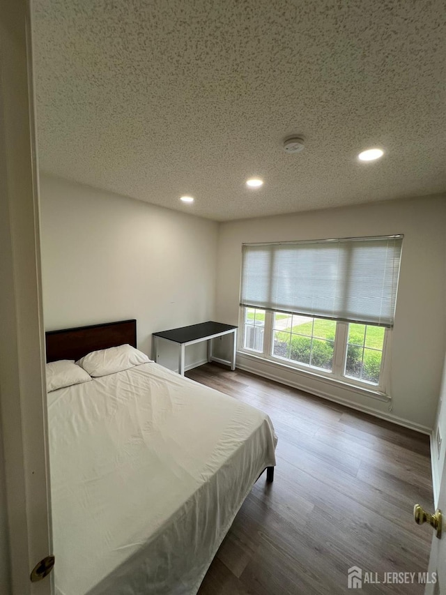 4108 Dilts Ln, Bridgewater, NJ 08807 - bedroom with recessed lighting, a textured ceiling, and dark wood-style floors