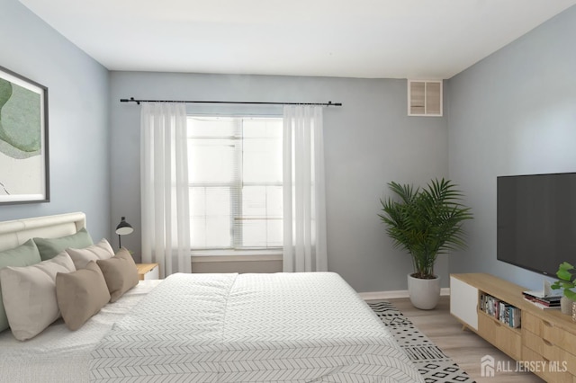 914 Cedar Ct, New Brunswick, NJ 08901 - bedroom featuring light wood-style floors and baseboards