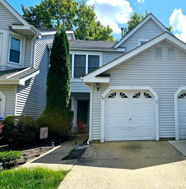 view of front of property featuring an attached garage and driveway