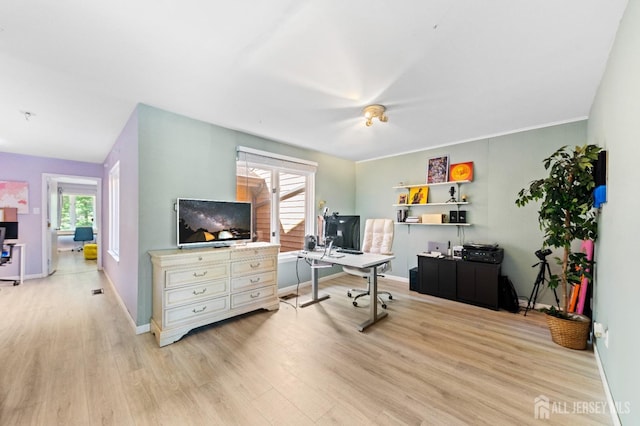 home office featuring light wood-style flooring and baseboards