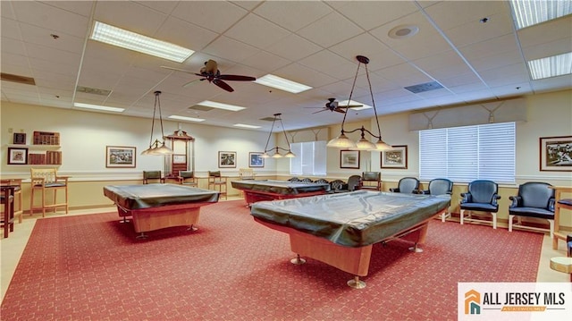 rec room with a drop ceiling, carpet floors, billiards, and ceiling fan