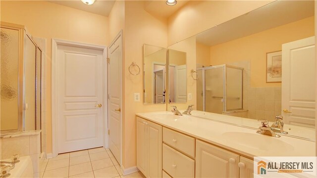 bathroom featuring vanity, separate shower and tub, and tile patterned flooring