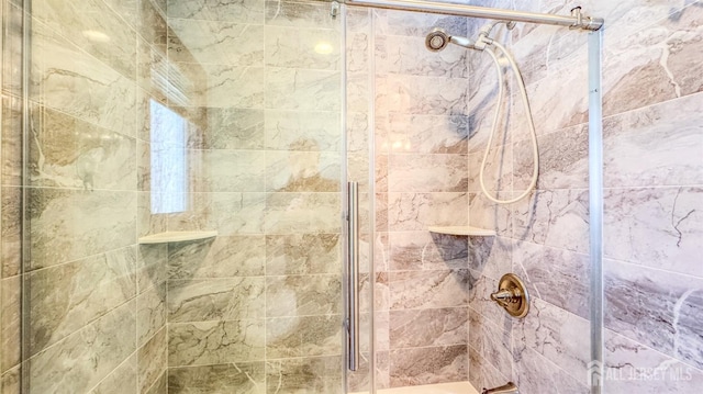bathroom featuring a shower stall