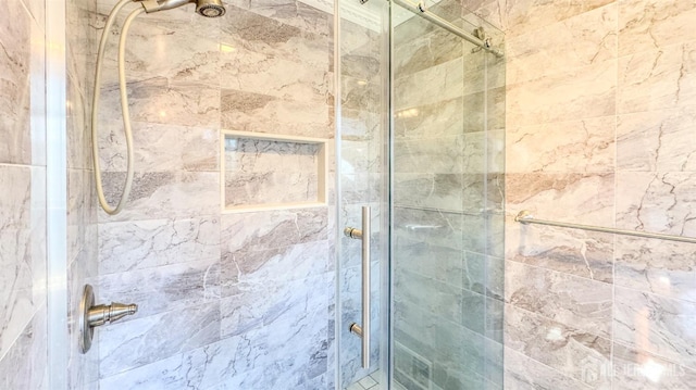 bathroom with a shower stall