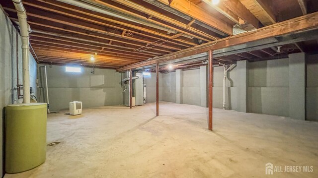 below grade area featuring heating unit