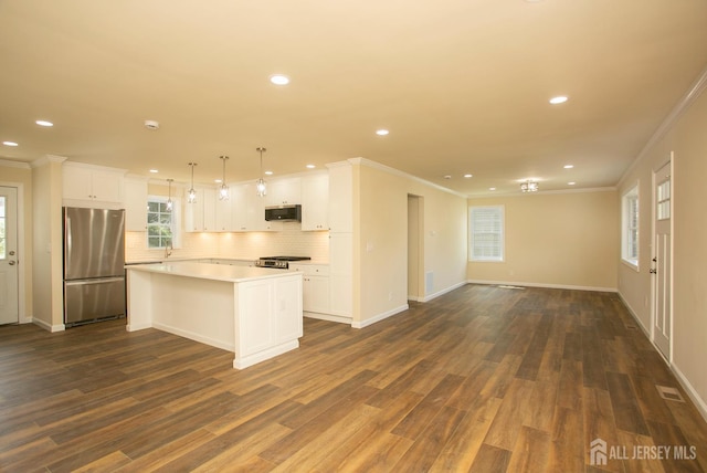 15 Bradley Dr, Edison, NJ 08817 - kitchen featuring appliances with stainless steel finishes, open floor plan, tasteful backsplash, recessed lighting, and dark wood-style flooring