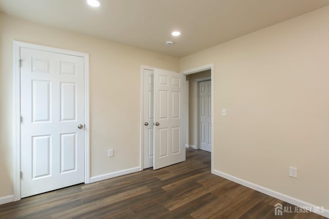 15 Bradley Dr, Edison, NJ 08817 - unfurnished bedroom featuring dark wood-style flooring and recessed lighting