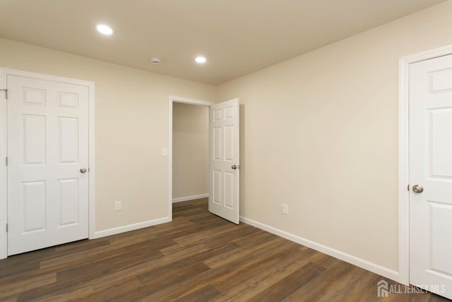15 Bradley Dr, Edison, NJ 08817 - unfurnished bedroom with dark wood-style flooring and recessed lighting