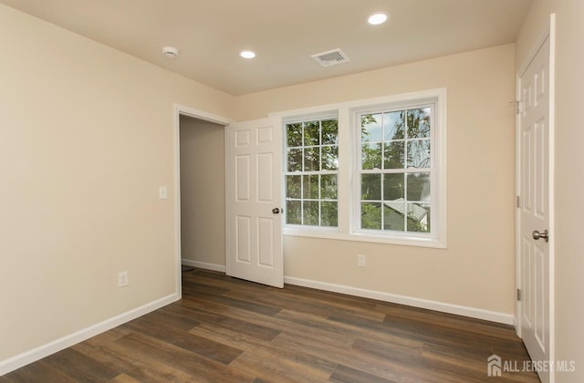 15 Bradley Dr, Edison, NJ 08817 - unfurnished bedroom with dark wood-style floors and recessed lighting