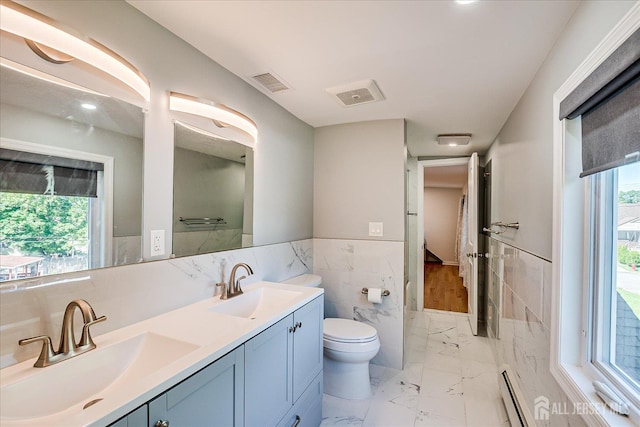 5 Alvin Ct, Menlo Park Terrace, NJ 08840 - full bathroom featuring tile walls, marble look tile flooring, baseboard heating, double vanity, and a wainscoted wall
