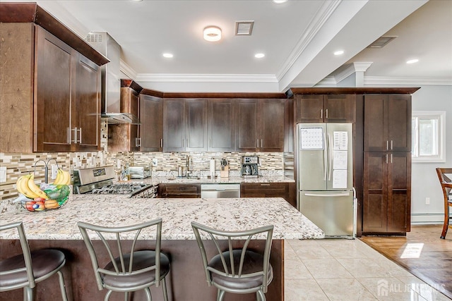5 Alvin Ct, Menlo Park Terrace, NJ 08840 - kitchen with stainless steel appliances, dark brown cabinetry, a peninsula, a baseboard radiator, and backsplash