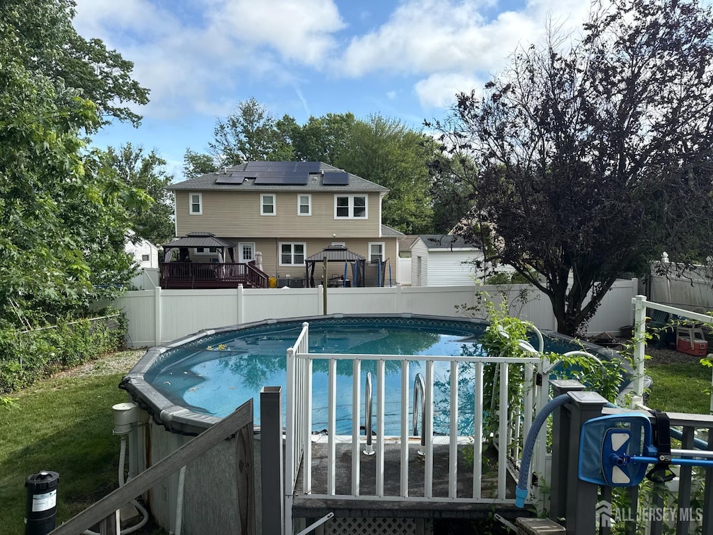 38 Victory Pl E, Brunswick, NJ 08816 - view of pool featuring a gazebo, a fenced backyard, and a wooden deck