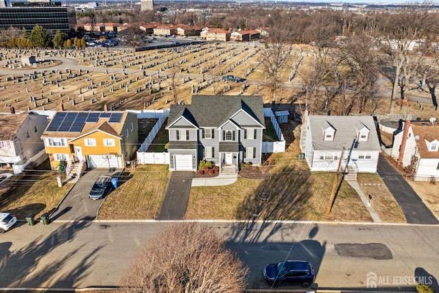 birds eye view of property with a residential view