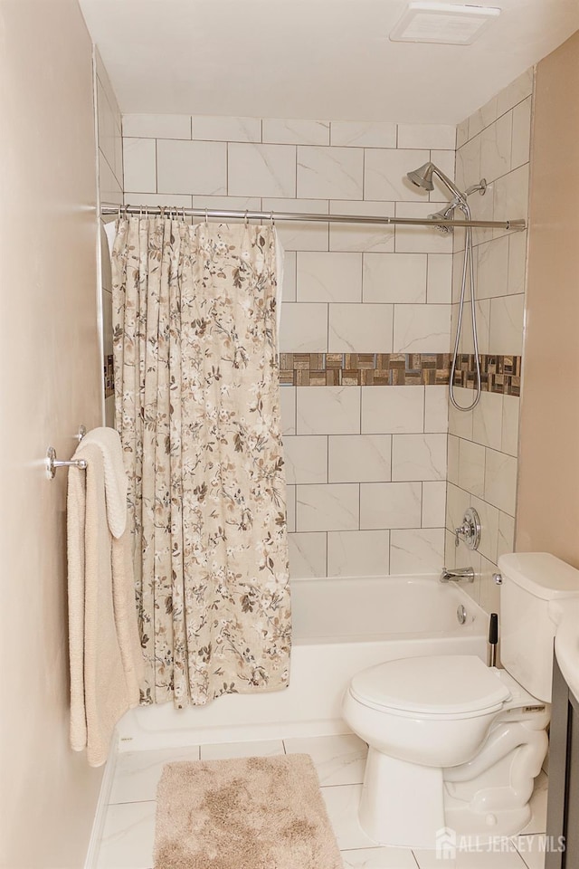 full bathroom featuring toilet and shower / tub combo