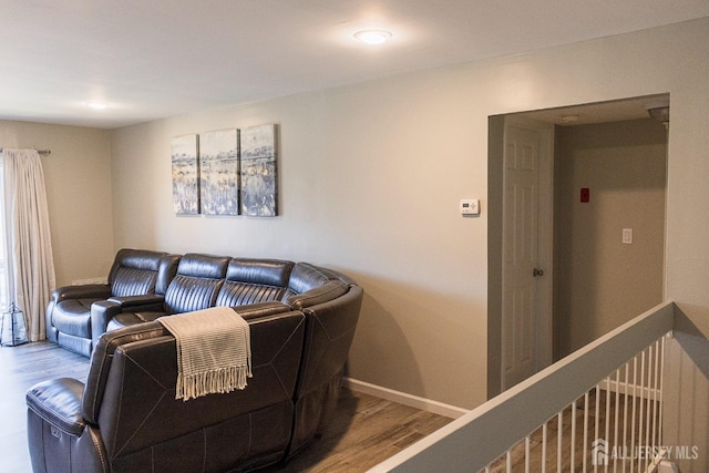 living area featuring wood finished floors, baseboards, and recessed lighting