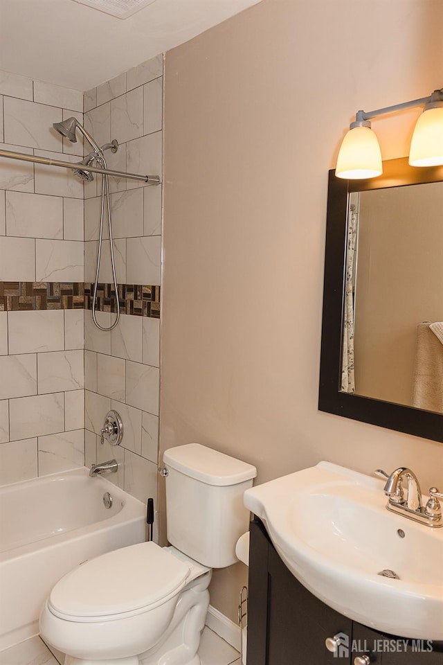 bathroom featuring toilet,  shower combination, vanity, and baseboards
