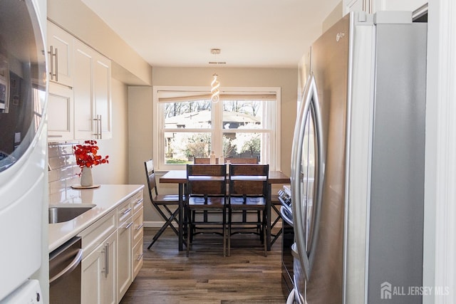 dining space with dark wood-type flooring
