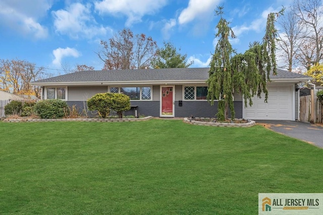 single story home featuring a front yard and a garage