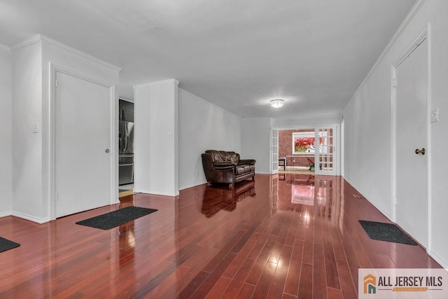 unfurnished room featuring crown molding and wood-type flooring