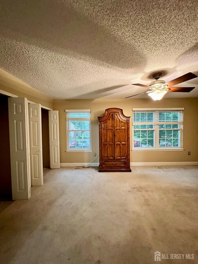 37 Albury Way N, Brunswick, NJ 08902 - unfurnished bedroom featuring a textured ceiling, carpet, and a ceiling fan