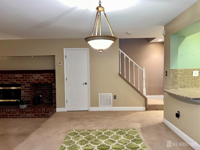 37 Albury Way N, Brunswick, NJ 08902 - unfurnished living room with carpet, stairway, and a fireplace