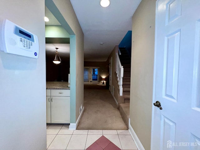 37 Albury Way N, Brunswick, NJ 08902 - corridor with light colored carpet, stairs, and light tile patterned floors