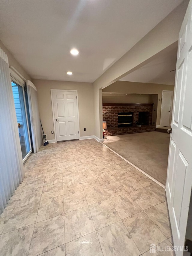 37 Albury Way N, Brunswick, NJ 08902 - unfurnished living room featuring a brick fireplace, recessed lighting, and light carpet