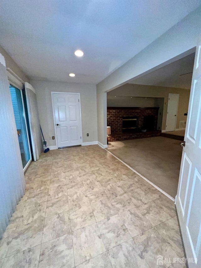 37 Albury Way N, Brunswick, NJ 08902 - unfurnished living room featuring a brick fireplace and recessed lighting