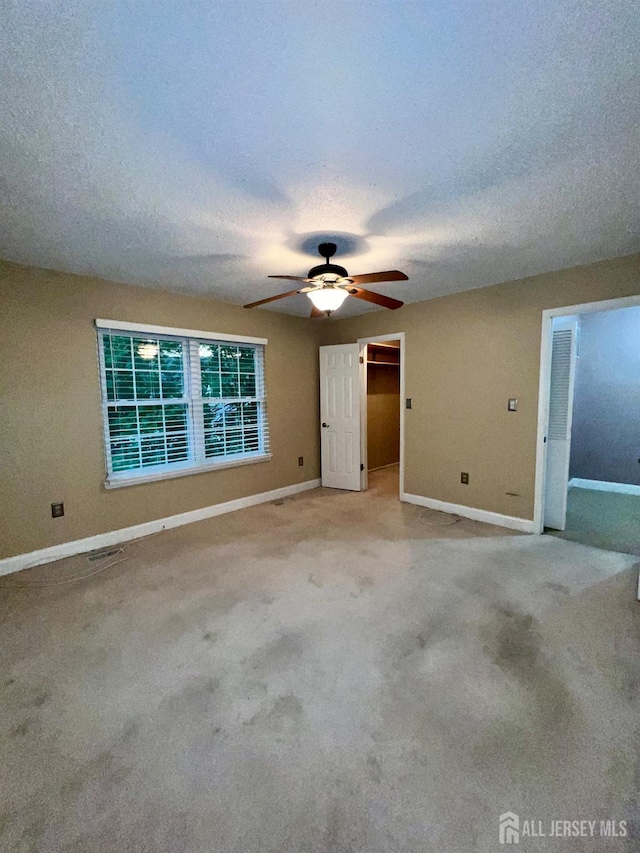 37 Albury Way N, Brunswick, NJ 08902 - carpeted spare room with a ceiling fan and a textured ceiling
